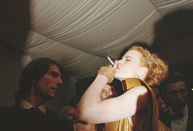 An iconic photo of Nicole Kidman smoking with her ex-husband Tom Cruise at a Vanity Fair Oscar Party has gone viral