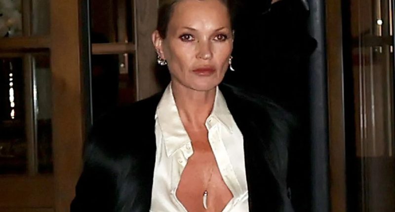 Kate Moss stuns in a plunging top at Paris Fashion Week