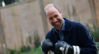Prince William wears a pair of boxing gloves during his visit to Centrepoint, a charity which supports homeless youth, in west London on Tuesday