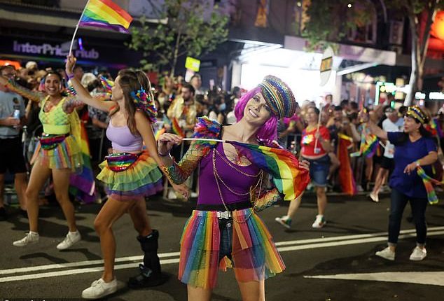 Not all mass produced fashions adopted from the United States, that saturate many aspects of Australian life, are worth keeping including 'diversity, equity and inclusion' (pictured are revellers at Sydney's 2023 Gay and Lesbian Mardi Gras)