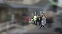 The moment before a schoolgirl (right, in black and white trainers) lunged at assistant headteacher Fiona Elias with a knife at Ysgol Dyffryn Aman in Carmarthenshire