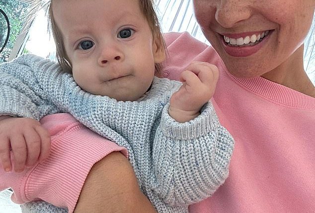 Women's empowerment coach Megsy Ann took to Instagram earlier this week to reveal her son Rambo Wolf 'left his physical body' on Thursday, January 30 in 'the warmth of his Papa’s arms'. Pictured: Megsy Ann and son Rambo Wolf