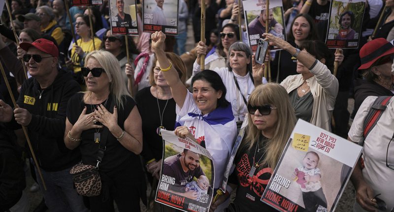 Hamas hands American-Israeli hostage over to Red Cross as part of a ceasefire deal with Israel