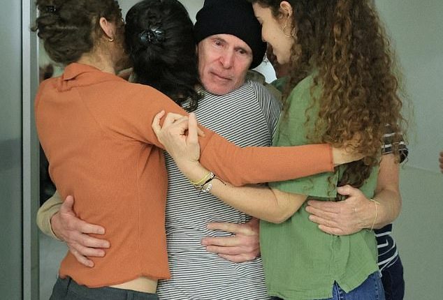 Released American-Israeli hostage, Keith Siegel, who was seized during the deadly October 7, 2023 attack by Hamas, embraces loved ones as he is reunited with his wife Aviva, his daughters Ilan, Gal and Shir and brother, Lee, at Sourasky Medical Center in Tel Aviv, Israe