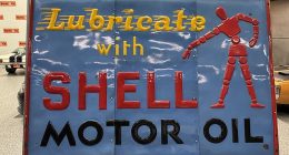 A 100-year-old blue enamel Shell sign (pictured) sold for $133,975 at auction last Thursday