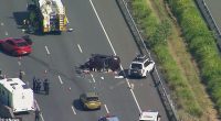 A man has been charged after a driver was allegedly shot and a woman killed in a crash on the Bruce Highway