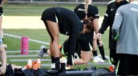 Two sports medicine experts have raised questions about the injured right hamstring Fowler was carrying when she ruptured a ligament in her right knee (Fowler is pictured with the hamstring strapped in Sydney two weeks before rupturing her ACL)