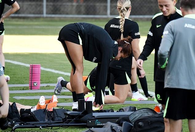 Two sports medicine experts have raised questions about the injured right hamstring Fowler was carrying when she ruptured a ligament in her right knee (Fowler is pictured with the hamstring strapped in Sydney two weeks before rupturing her ACL)