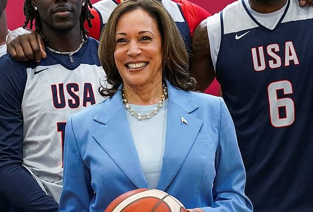 U.S. Vice President Kamala Harris poses for a group picture with LeBron James and other members of the U.S. men's Olympic basketball team,