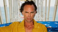 White Lotus star Walton Goggins reveals eye-catching bulge in skintight yellow speedo for Cultured photoshoot