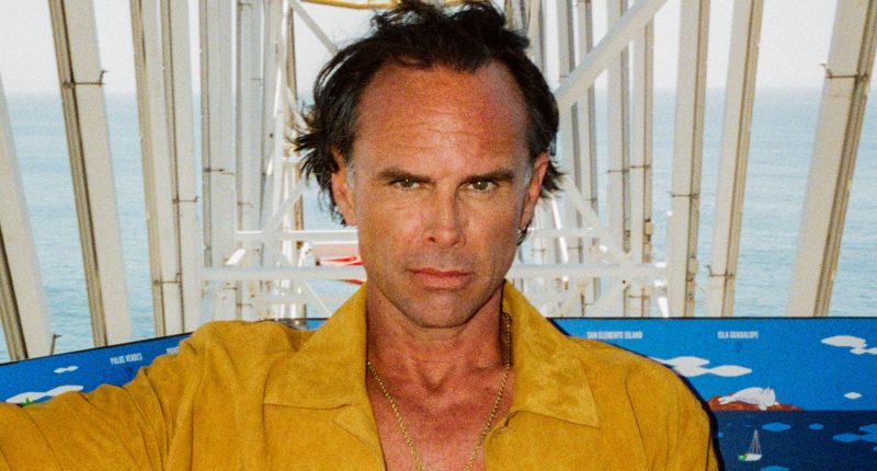 White Lotus star Walton Goggins reveals eye-catching bulge in skintight yellow speedo for Cultured photoshoot