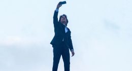 Daring Tom Cruise, 62, in latest risky stunt as he scales roof of UK cinema for selfie to promote new film