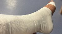 Devastated boyband star shares hospital snap and reveals he will be on crutches for months