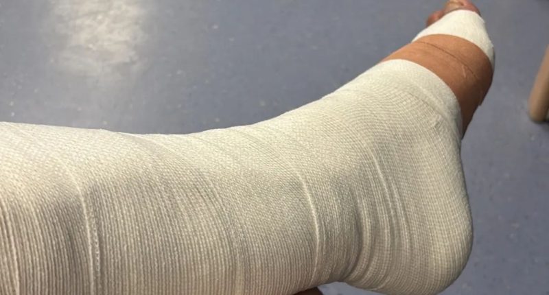 Devastated boyband star shares hospital snap and reveals he will be on crutches for months