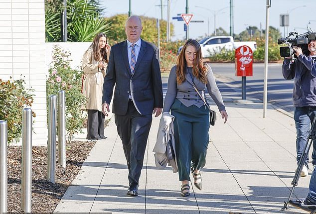 Simon Patterson and his media representative Jessica O'Donnell enter the Latroba Valley law courts on Friday
