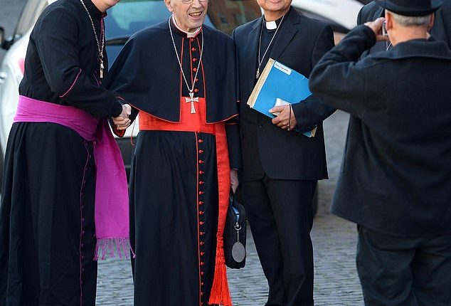In 2013, child abuse protestor Ralph Napierski (left, having a picture with Cardinal Sergio Sebiastiana outside the Vatican) posed as a cardinal in an attempt to disrupt that year's conclave. He was only rumbled when guards noticed his robes were too short and his fascia (sash) was pink rather than red