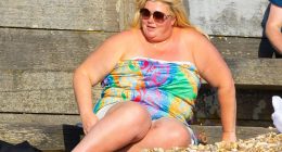 Gemma Collins soaks up the sun on the beach in strapless dress after revealing weight loss jabs had transformed her life