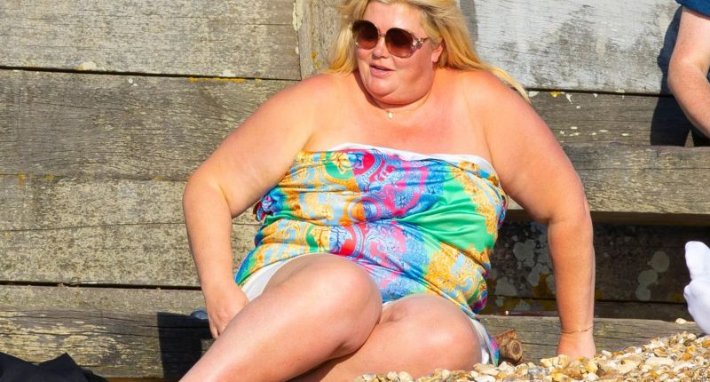 Gemma Collins soaks up the sun on the beach in strapless dress after revealing weight loss jabs had transformed her life