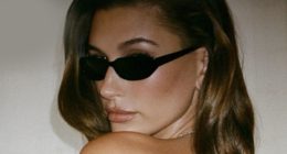 Hailey Bieber goes topless and reveals back tattoo in just cheeky shorts after Justin flees to Iceland