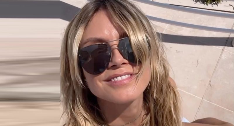 Heidi Klum nearly busts out of pink bikini as husband Tom Kaulitz rubs sunblock on her butt during Cannes getaway