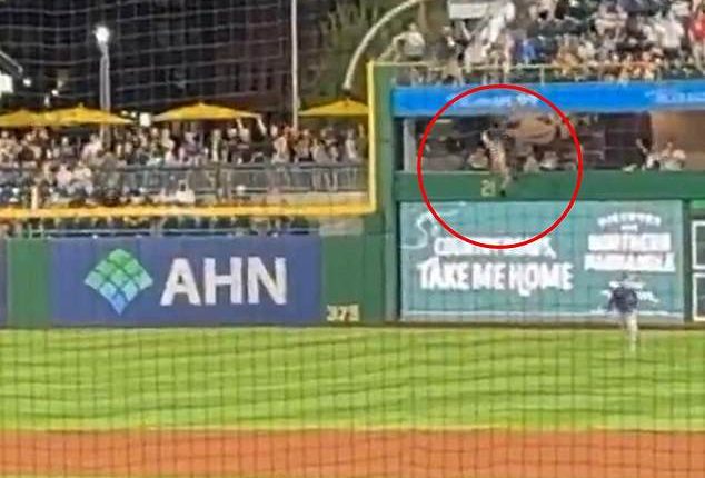 The fan fell over the wall in right field at the Pirates game on Wednesday night