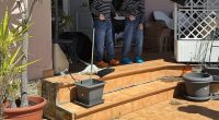 Two of the children are lead from the house in Spain after police intervened on Wednesday