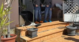 Two of the children are lead from the house in Spain after police intervened on Wednesday