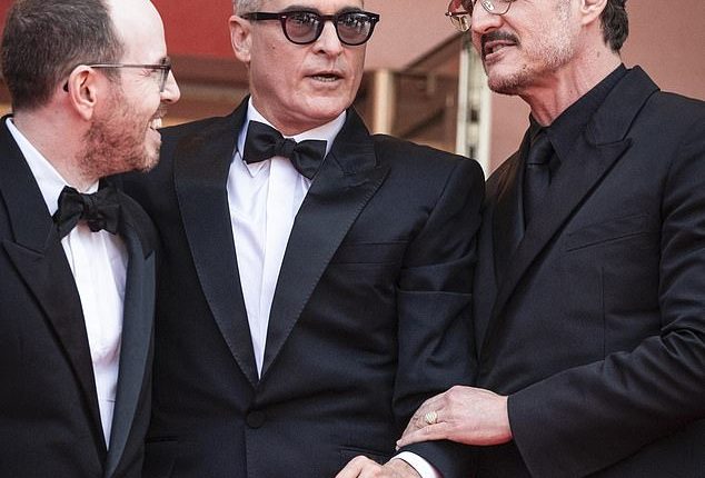 A lip reader has explained what Pedro Pascal told Joaquin Phoenix after he pulled down the actor's waving hand while on the red carpet of the Cannes Film Festival
