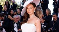Michelle Keegan looks stunning on the Cannes red carpet as she leads stars in striking white hat