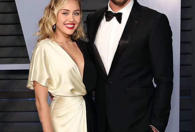 Miley Cyrus reflected on the 'dark time' when she and her ex-husband Liam Hemsworth lost their $2.525M four-bedroom Malibu house in the 2018 Woolsey Fire (pictured in 2018)