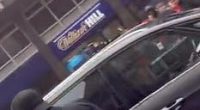 Footage from Water Street - where the chaos unfolded - shows fans surrounding a Ford Galaxy and shouting 'what are you doing?' as it surges back and forth