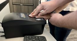 A Flagler County Sheriff’s Office Public Service Officer at the Flagler Sheriff’s Operations Center scans fingerprints for a background check. (FCSO)