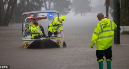 epaselect epa12124624 NSW Fire Rescue personnel assist an elderly resident during flooding in Port Macquarie, New South Wales, Australia, 22 May 2025. A slow-moving trough is dumping rain along the east coast of Australia, leaving thousands of people stranded.  EPA/Lindsay Moller AUSTRALIA AND NEW ZEALAND OUT