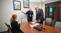 Doug Thomas, center, executive vice president of SGR, the executive recruiting firm, setting up one of the one-on-one interviews of candidate Rich Hough with City Council member Theresa Pontieri at City Hall last week. (© FlaglerLive)