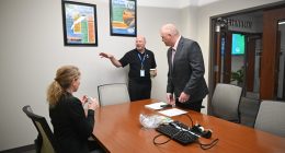 Doug Thomas, center, executive vice president of SGR, the executive recruiting firm, setting up one of the one-on-one interviews of candidate Rich Hough with City Council member Theresa Pontieri at City Hall last week. (© FlaglerLive)