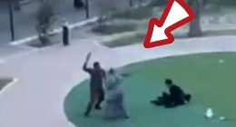 A man wielding a belt or leather strap rushes appears to attack women who were protesting