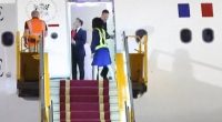 Footage shot by the Associated Press news agency in Hanoi on Sunday evening shows Macron's plane door opening to reveal him