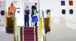 Footage shot by the Associated Press news agency in Hanoi on Sunday evening shows Macron's plane door opening to reveal him