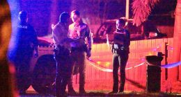 A crime scene has been set up after a child was found dead at a Moore Park Beach home near Bundaberg on Monday afternoon. Pictured are detectives at the scene