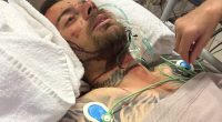 Anthony Bell, 33, is pictured in critical condition in a Perth hospital after suffering brain bleeding and 19 broken bones from 3.5m fall through a skylight