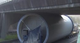 The enormous wind turbine part is jammed under the bridge, causing major disruptions