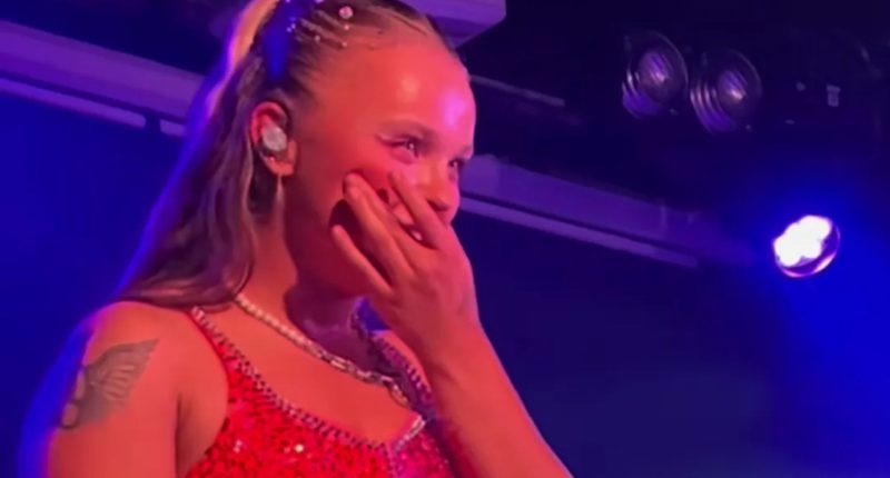 Watch as JoJo Siwa makes Chris Hughes blush with cute tribute as he proudly watches her perform in London