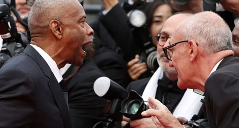 Watch shock moment Denzel Washington hits out at Cannes photographer in explosive red carpet clash
