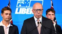 A dejected Peter Dutton concedes defeat both in the federal election and in his own seat while flanked by his sons, Harry and Tom, on Saturday night