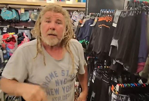A Kmart customer pictured) confronted a prankster after being tricked into thinking money  had been stolen from him