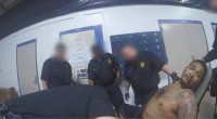 ‘Treated him worse than an animal’: Officers seen ‘laughing and joking’ at mentally ill military veteran they strapped to a restraint chair, lawsuit says