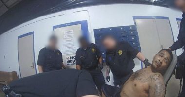 ‘Treated him worse than an animal’: Officers seen ‘laughing and joking’ at mentally ill military veteran they strapped to a restraint chair, lawsuit says