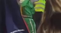 The bus driver appeared to be punched in the face by the man in the green jumpsuit (pictured)