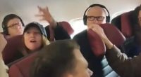 A Perth woman (above, gesturing at a stewardess) travelling from Western Australia to Melbourne was hauled off a plane before departure after a bizarre altercation with cabin crew