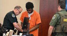 Brendan Depa getting finger-printed after his sentencing hearing on Aug. 6, 2024. (© FlaglerLive)